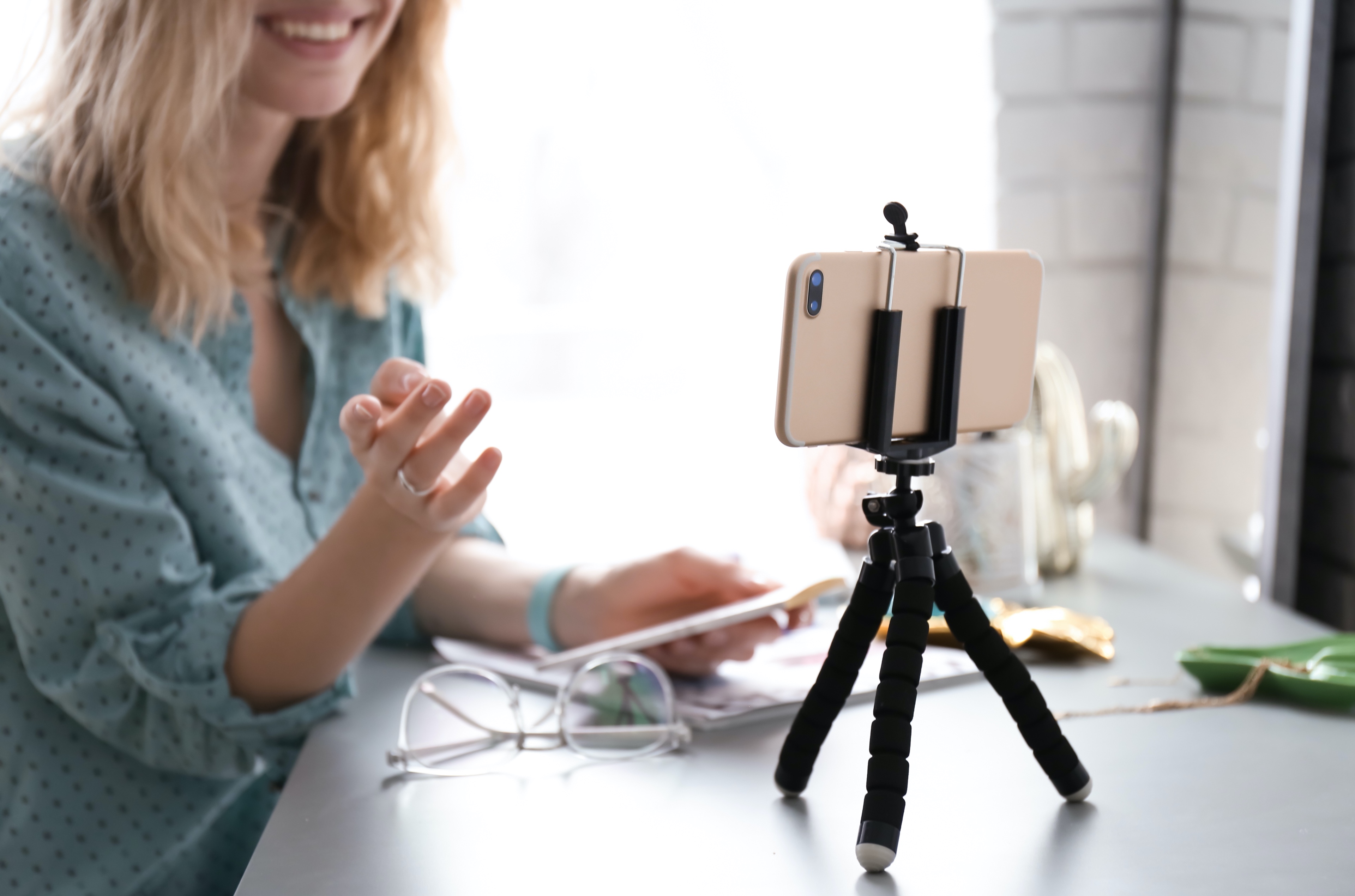Copy_of_community-voices-woman-with-smartphone-tripod.jpg