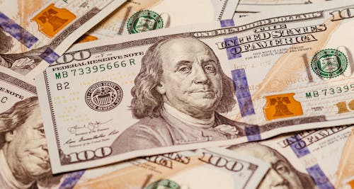 stacks of hundred dollar bills