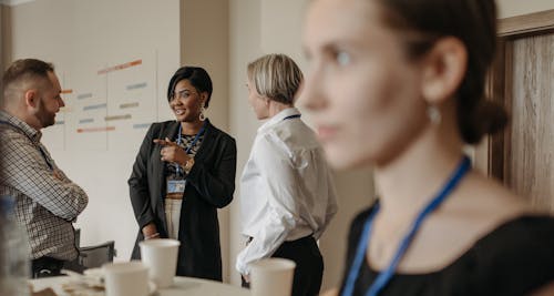 Group of People Having a Discussion in an Office